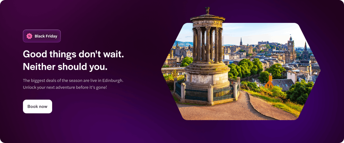 Calton Hill with Dugald Stewart Monument overlooking Edinburgh cityscape.